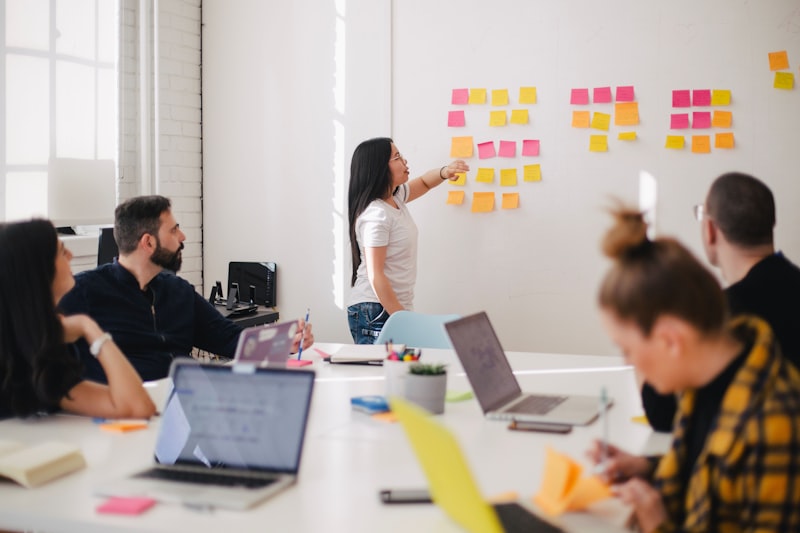 Manager in a team meeting struggling to lead and retain top employees